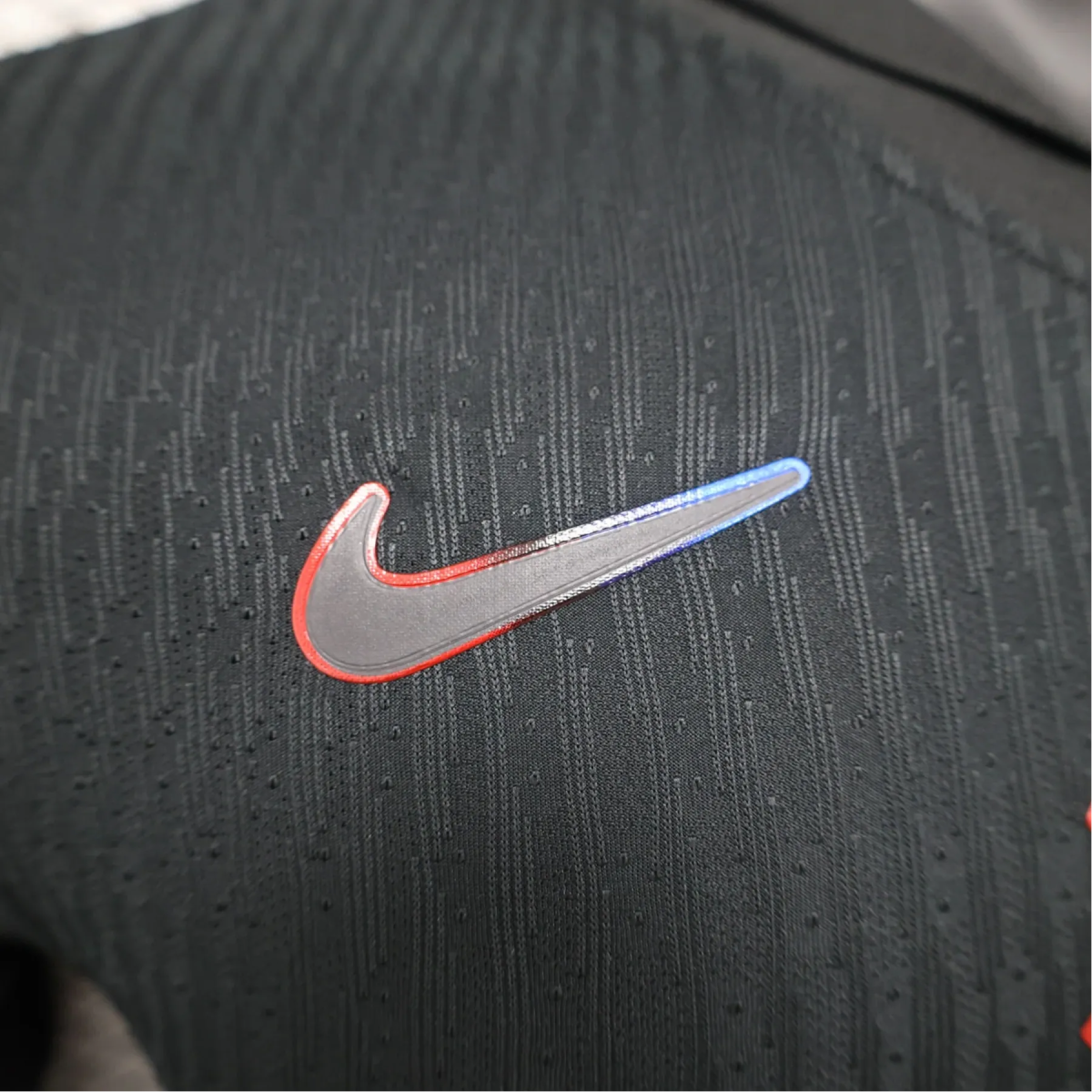 Barcelona 24/25 away kit player version black athletic performance red blue heritage construction